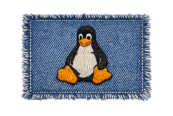 remendo — denim patch with embroidered Tux